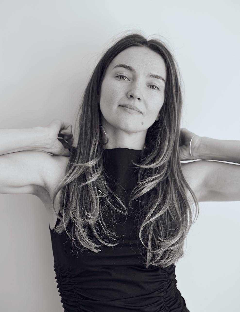 Black and white portrait of Alina in a dark top